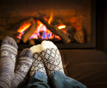 5020274 Feet Warming By Fireplace